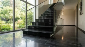 Dallage et escalier en granit noir profond, surface polie, ambiance élégante et moderne, rendu réaliste, lumière naturelle.